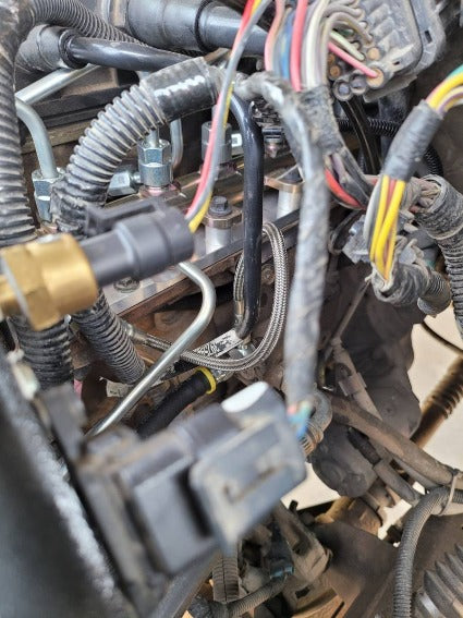 Load image into Gallery viewer, Glacier Diesel Power | 2007.5-2018 Dodge Ram 6.7L Cummins Steel Braided Fuel Rail Return Line